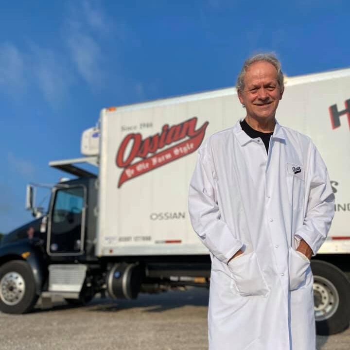 worker from Ossian Smoked Meats standing in front of delivery truck
