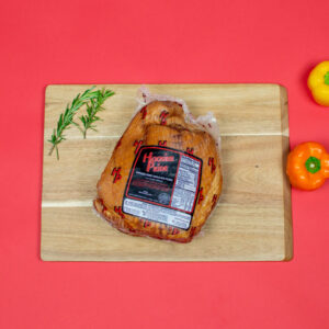 Smoked pork shoulder picnic in package on cutting board